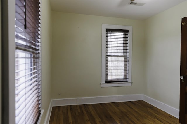 unfurnished room featuring dark hardwood / wood-style floors