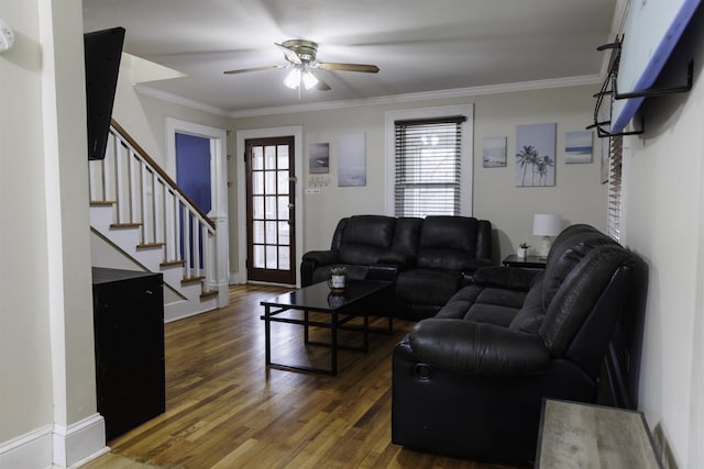 living room with ceiling fan, ornamental molding, and dark hardwood / wood-style flooring