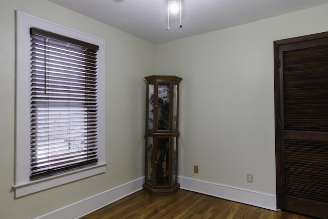 empty room featuring dark hardwood / wood-style flooring