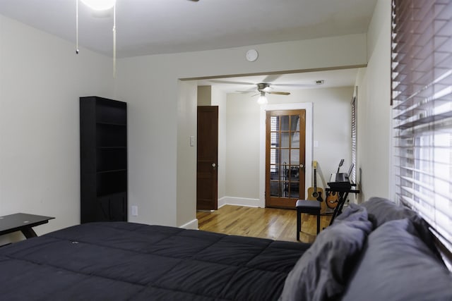 bedroom featuring ceiling fan and light hardwood / wood-style flooring