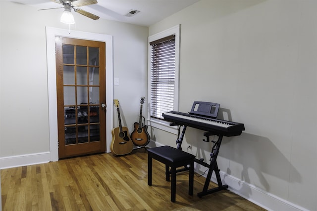 misc room featuring ceiling fan and wood-type flooring