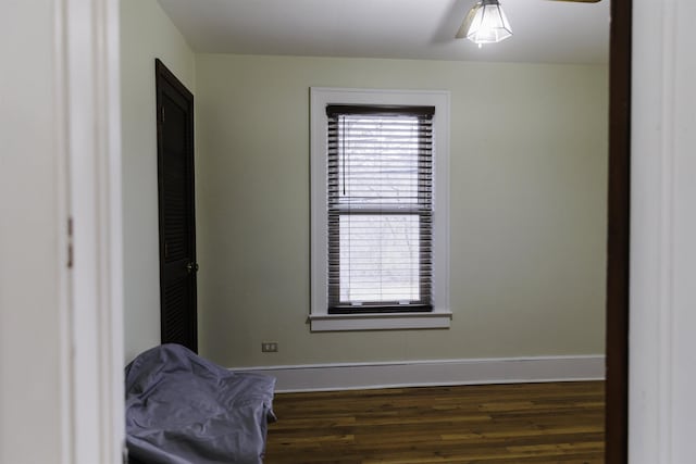 unfurnished room featuring dark hardwood / wood-style floors