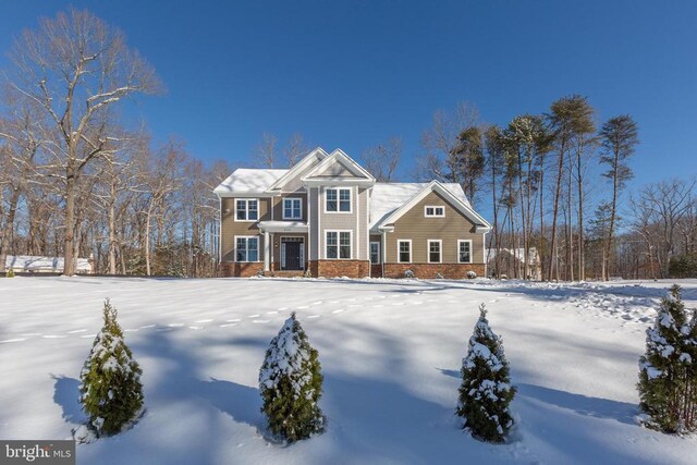 craftsman-style home with a front yard