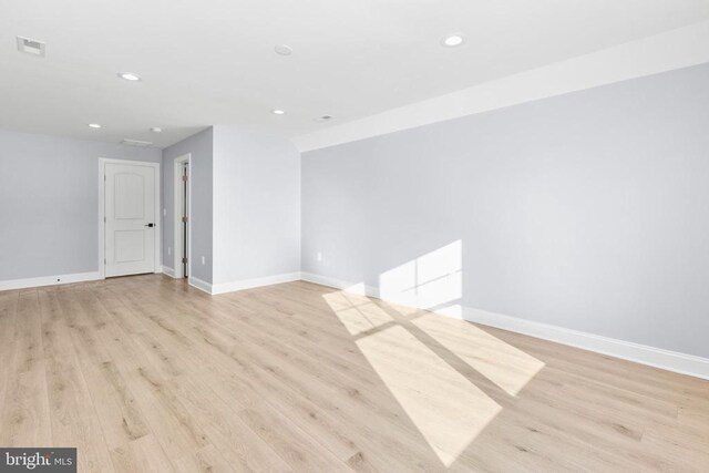 unfurnished bedroom featuring light hardwood / wood-style floors and a closet