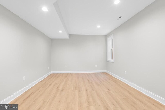 spare room featuring light wood-type flooring