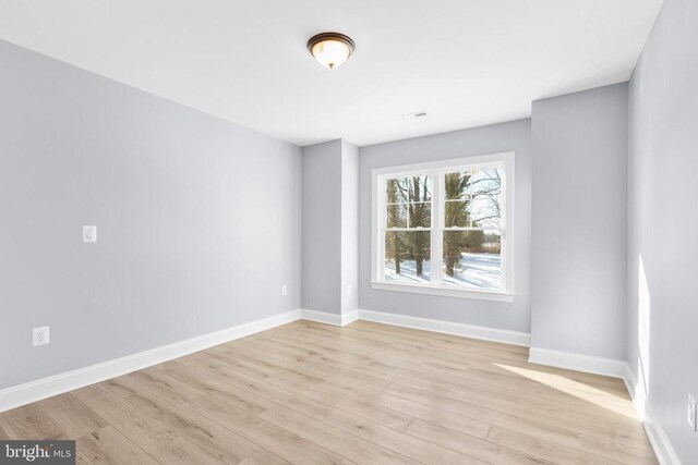 empty room with light wood-type flooring