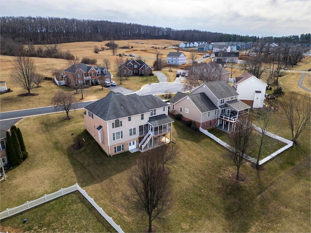 birds eye view of property with a residential view