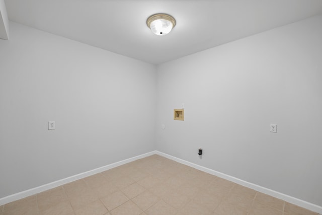 unfurnished room featuring baseboards