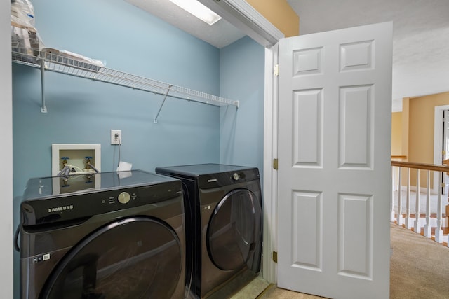 laundry room with laundry area, carpet flooring, and washing machine and dryer