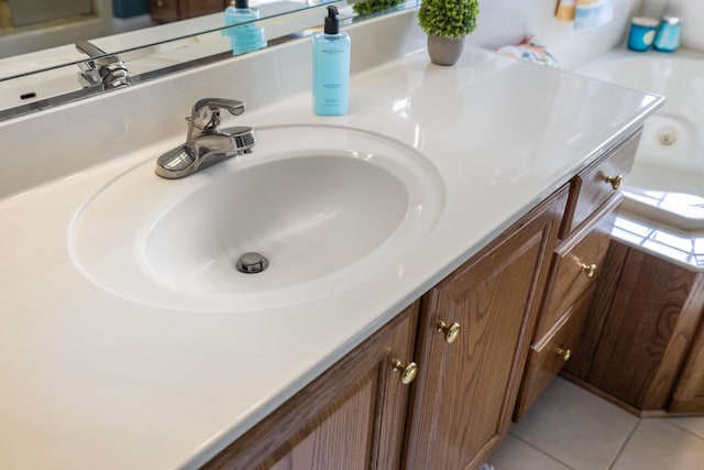 bathroom with vanity and tile patterned flooring