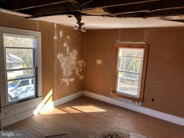 spare room featuring hardwood / wood-style flooring