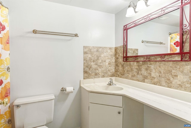 full bathroom with vanity and toilet