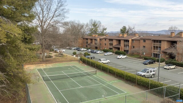 view of tennis court with fence