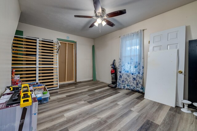 bedroom with ceiling fan and light hardwood / wood-style floors