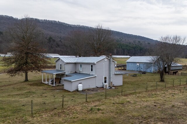 exterior space featuring a mountain view and a rural view