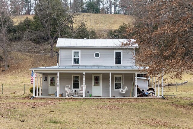 view of front of house featuring a front yard and a porch