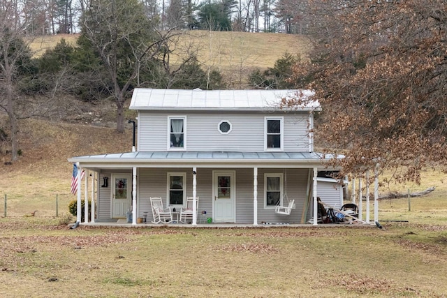 view of front of house featuring a front yard and a porch