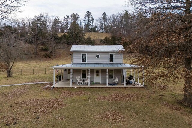 view of front facade with a porch and a front yard