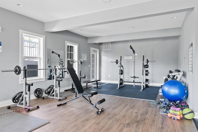 workout area with wood-type flooring