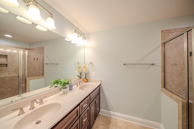 bathroom with walk in shower, tile patterned floors, and vanity