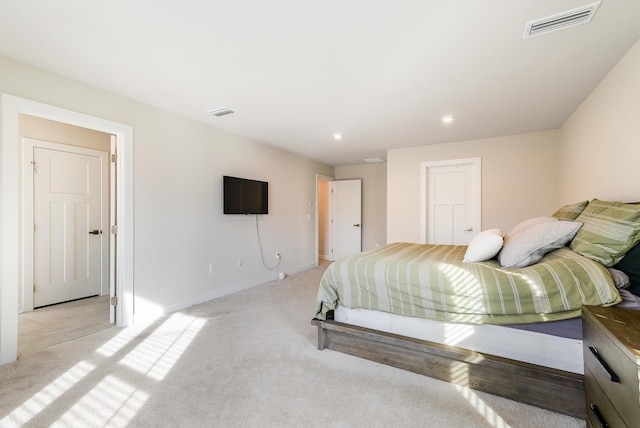 bedroom with light colored carpet