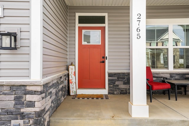 doorway to property with covered porch