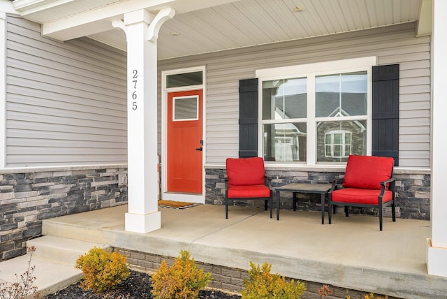 doorway to property with covered porch