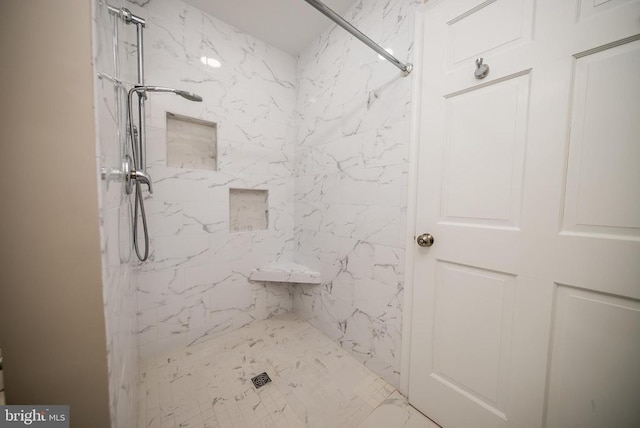 full bathroom with a marble finish shower