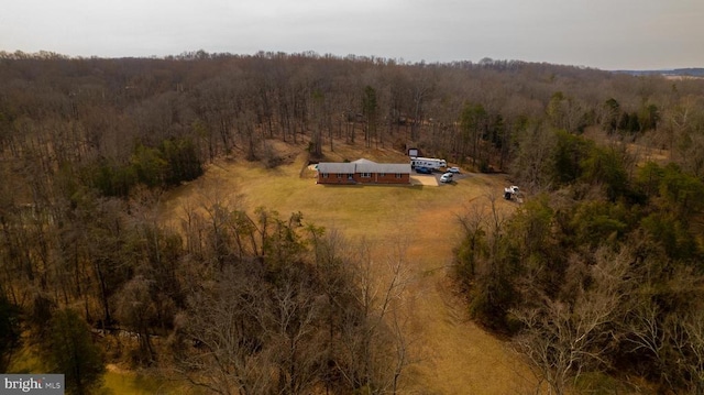 bird's eye view featuring a rural view and a wooded view