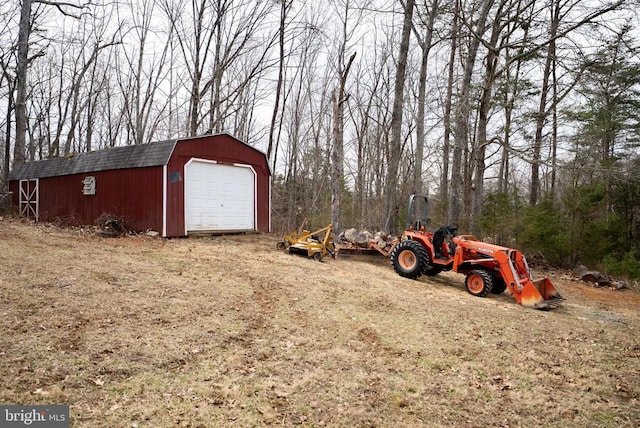 exterior space featuring an outbuilding and a detached garage