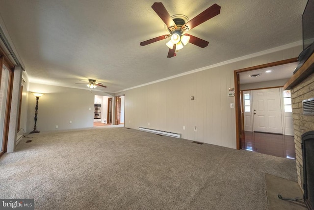 unfurnished living room with carpet floors, a baseboard radiator, ornamental molding, and a textured ceiling