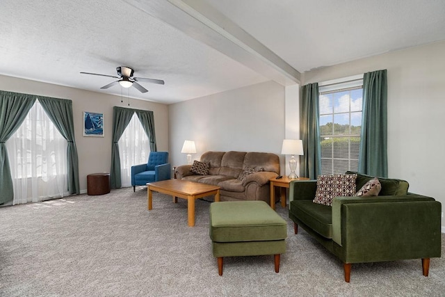 living area featuring a ceiling fan and light colored carpet