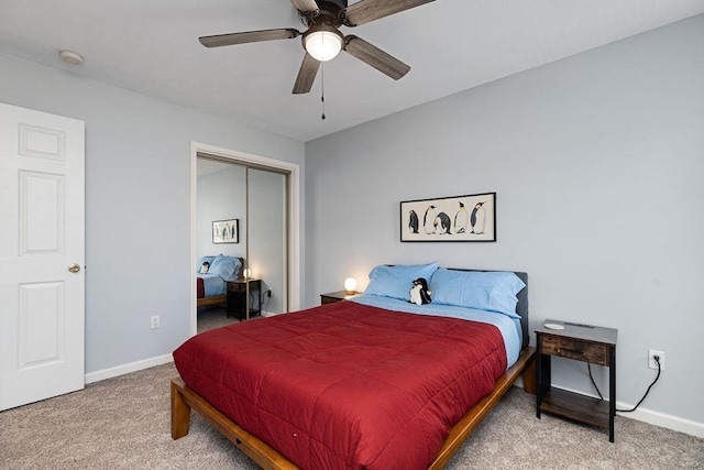 bedroom featuring baseboards, carpet flooring, and a closet