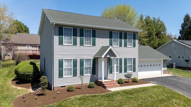 colonial-style house featuring central AC unit, crawl space, aphalt driveway, an attached garage, and a front yard