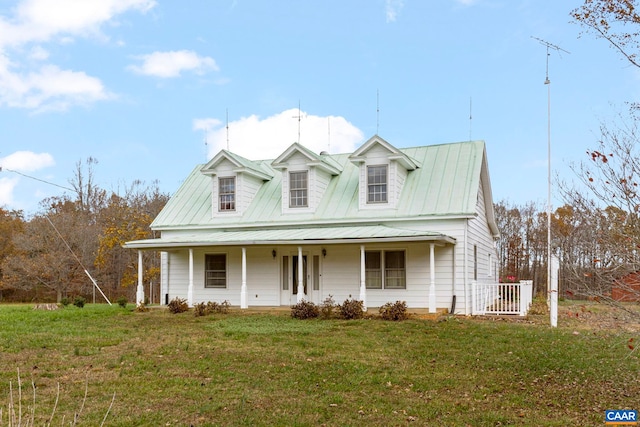 view of front of home with a front yard and covered porch