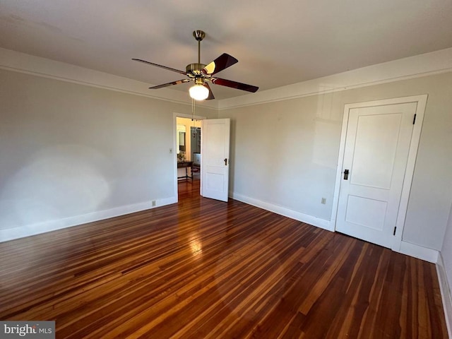 interior space featuring dark wood finished floors, baseboards, and ceiling fan