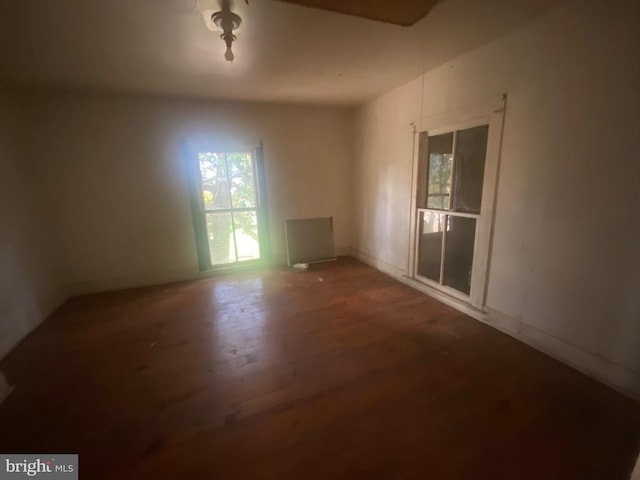 unfurnished room featuring hardwood / wood-style flooring