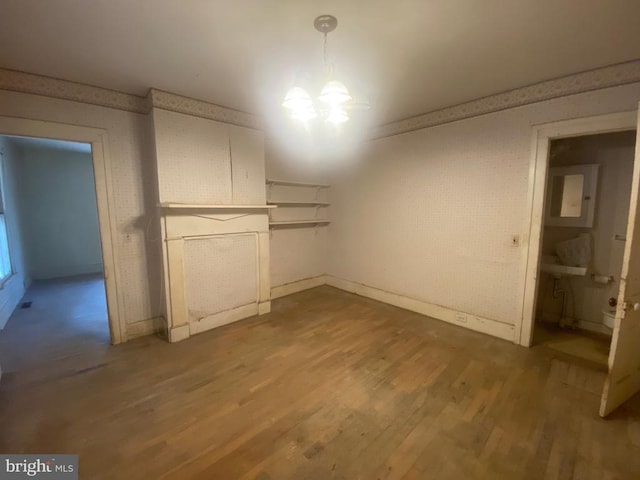 interior space featuring a chandelier and hardwood / wood-style floors