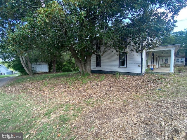 exterior space featuring a shed