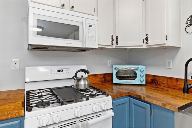 kitchen featuring blue cabinetry, wood counters, white appliances, and white cabinetry