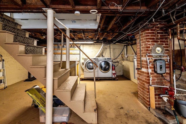 unfinished below grade area with stairs and separate washer and dryer