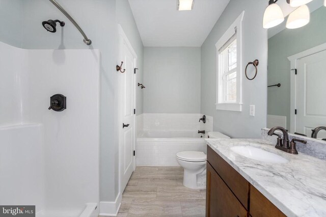 bathroom featuring a shower, toilet, a tub, and vanity