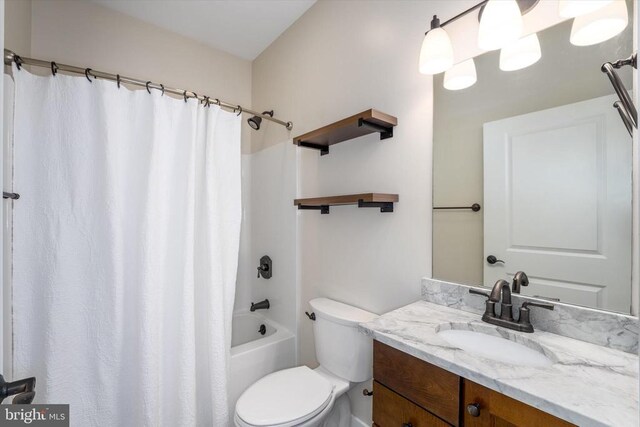 bathroom with vanity, toilet, and shower / tub combo with curtain