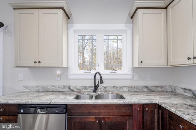 kitchen featuring dark brown cabinetry, white cabinets, dishwasher, and a sink