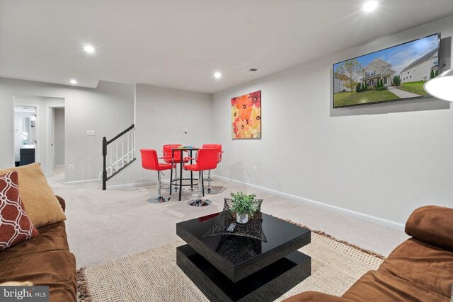 living room with light colored carpet