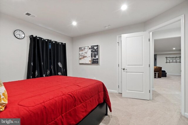 bedroom with light carpet