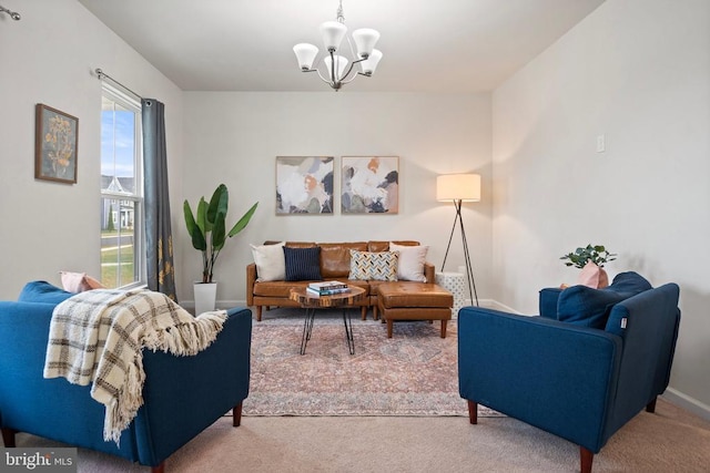 living room featuring carpet floors and a chandelier