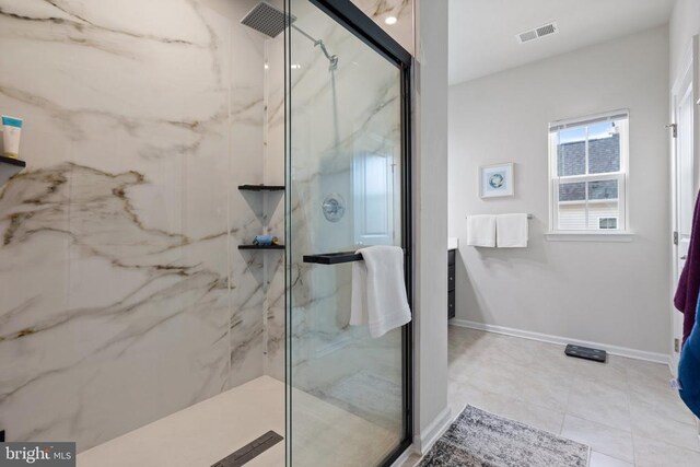 bathroom featuring a shower with shower door