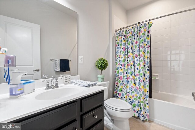 full bathroom featuring vanity, shower / tub combo, and toilet