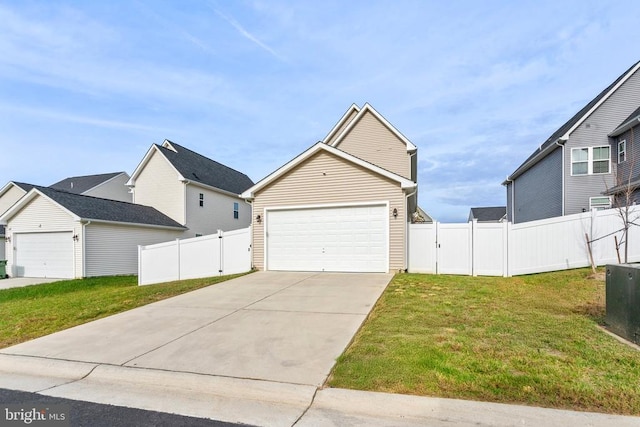 view of front of house with a garage and a front lawn